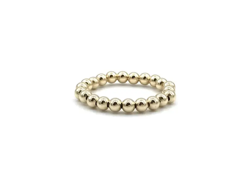 Elastische basis ring Noémi met real gold plated balletjes